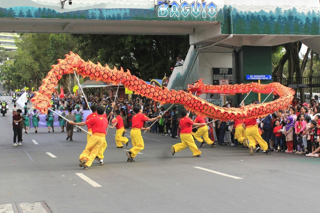 Dragon dance performance with performers in parade costume.