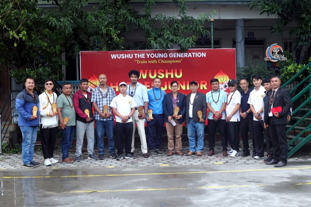 Organisers and guests with event banner